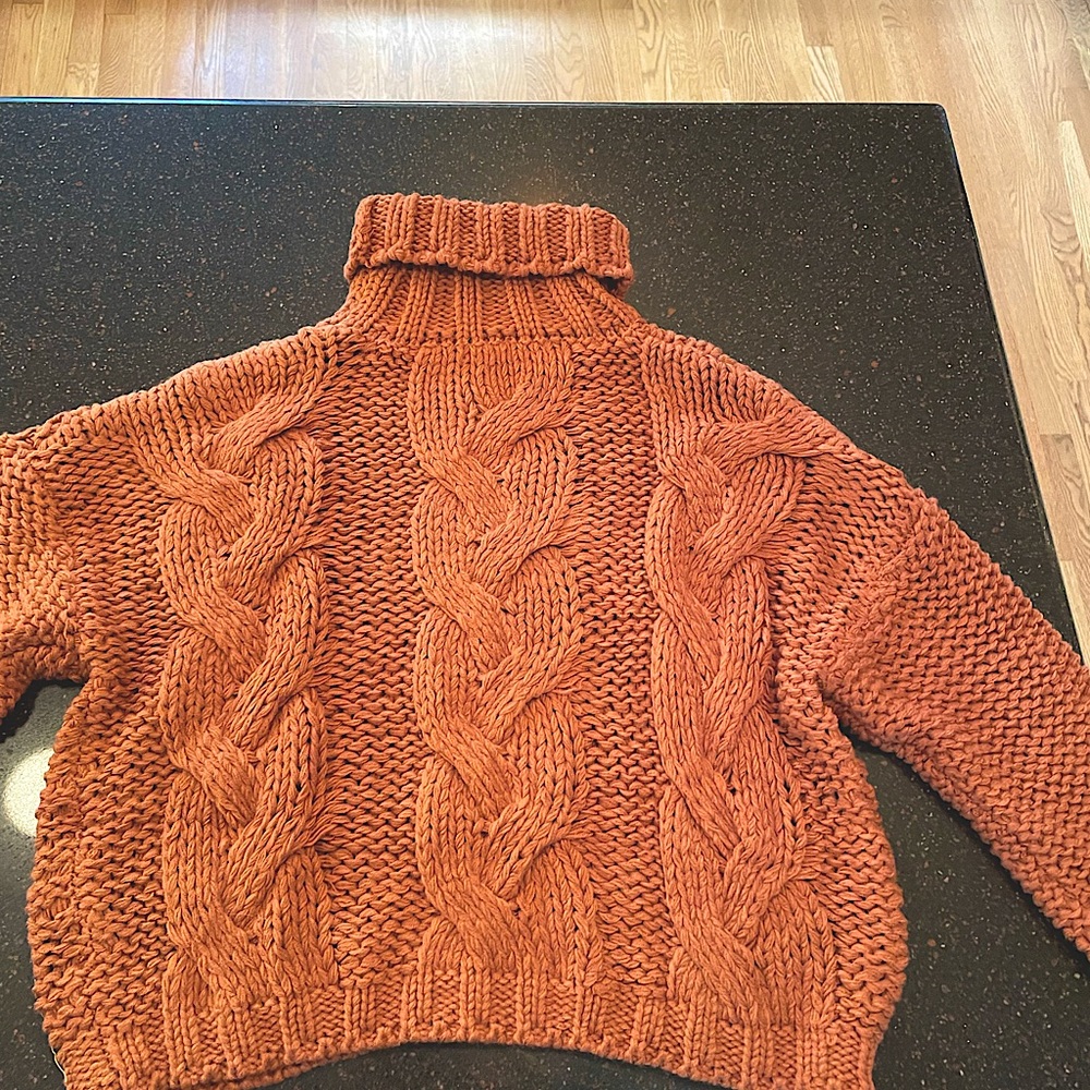 Rust colored cable knit turtleneck sweater